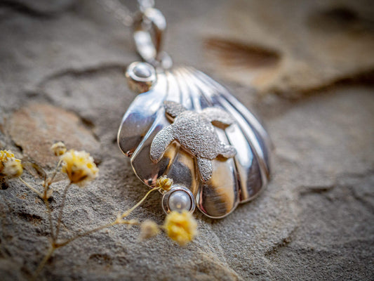 Sterling silver turtle resting on a seashell with two freshwater cultured pearls - Sippi Jewellery handcrafted piece